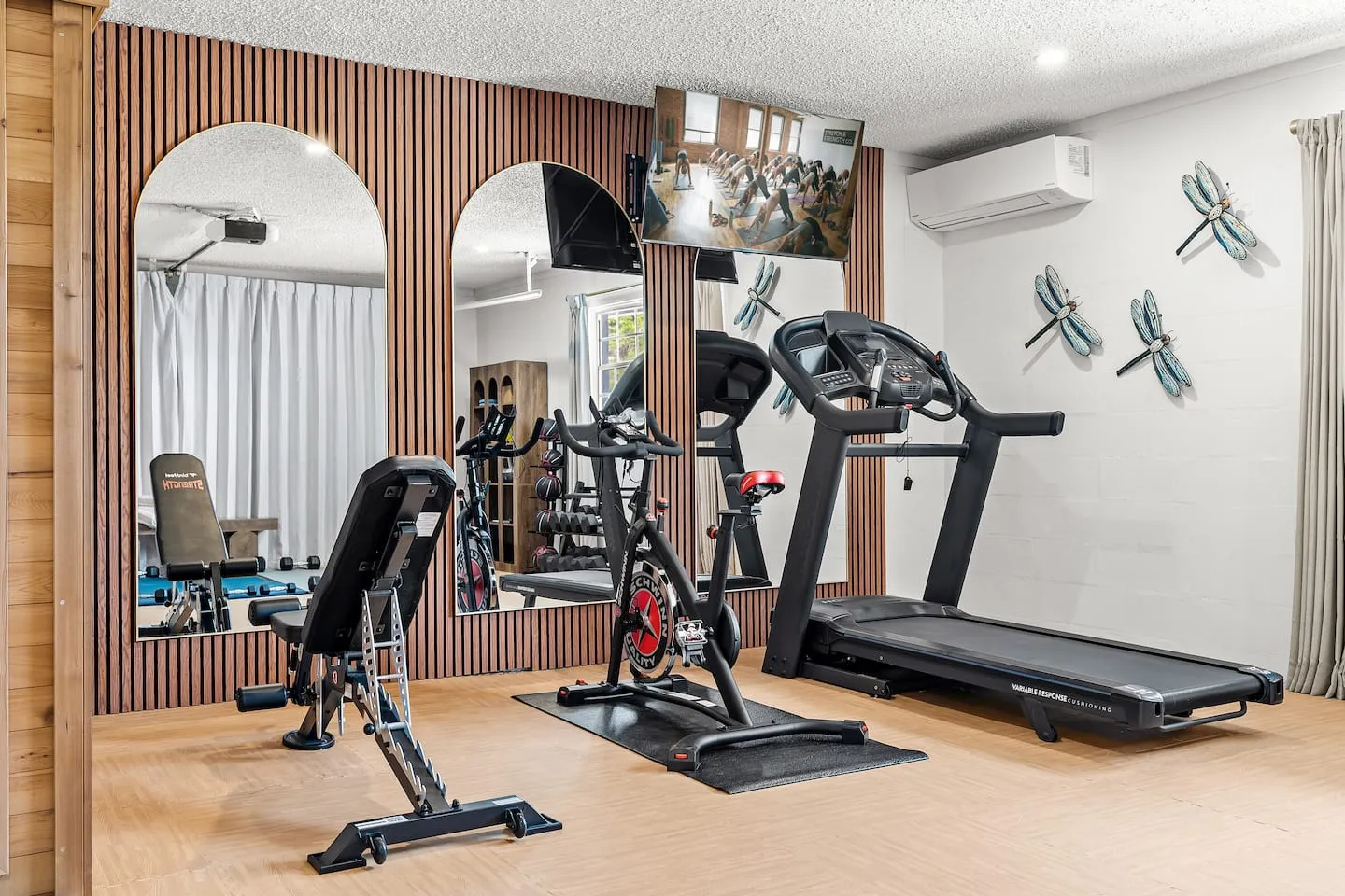 The Breezy Palm: full home gym with treadmill, bike and weights