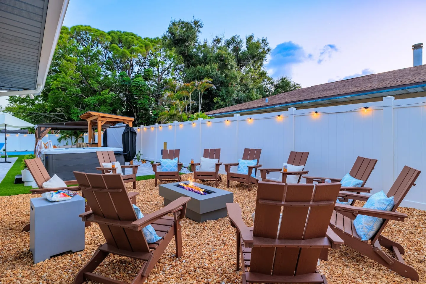 The Breezy Palm: fire pit with seating for the group