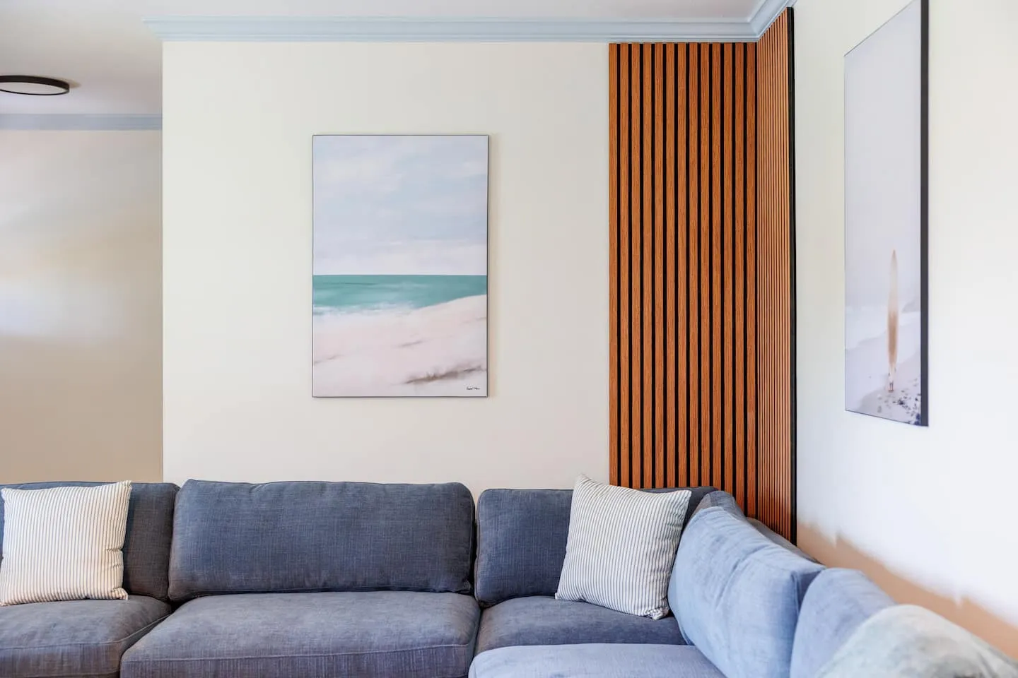 The Breezy Palm: living room sofa and coastal art