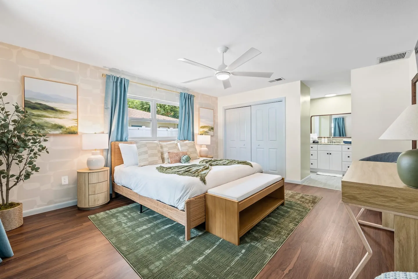 The Breezy Palm: bedroom with rug and bench