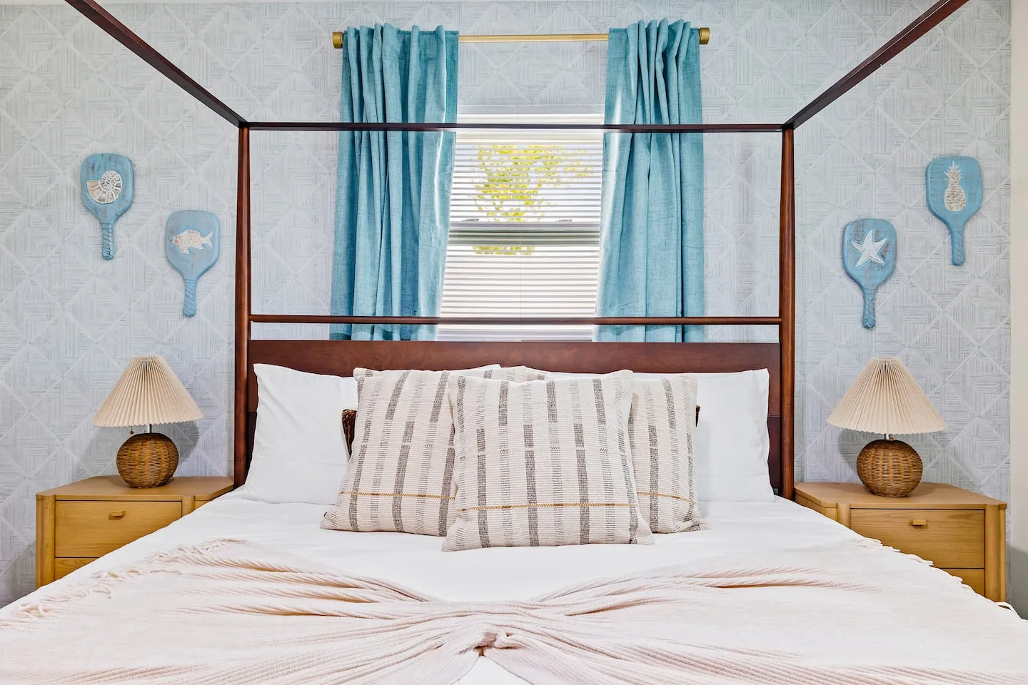 The Breezy Palm: bedroom with canopy bed