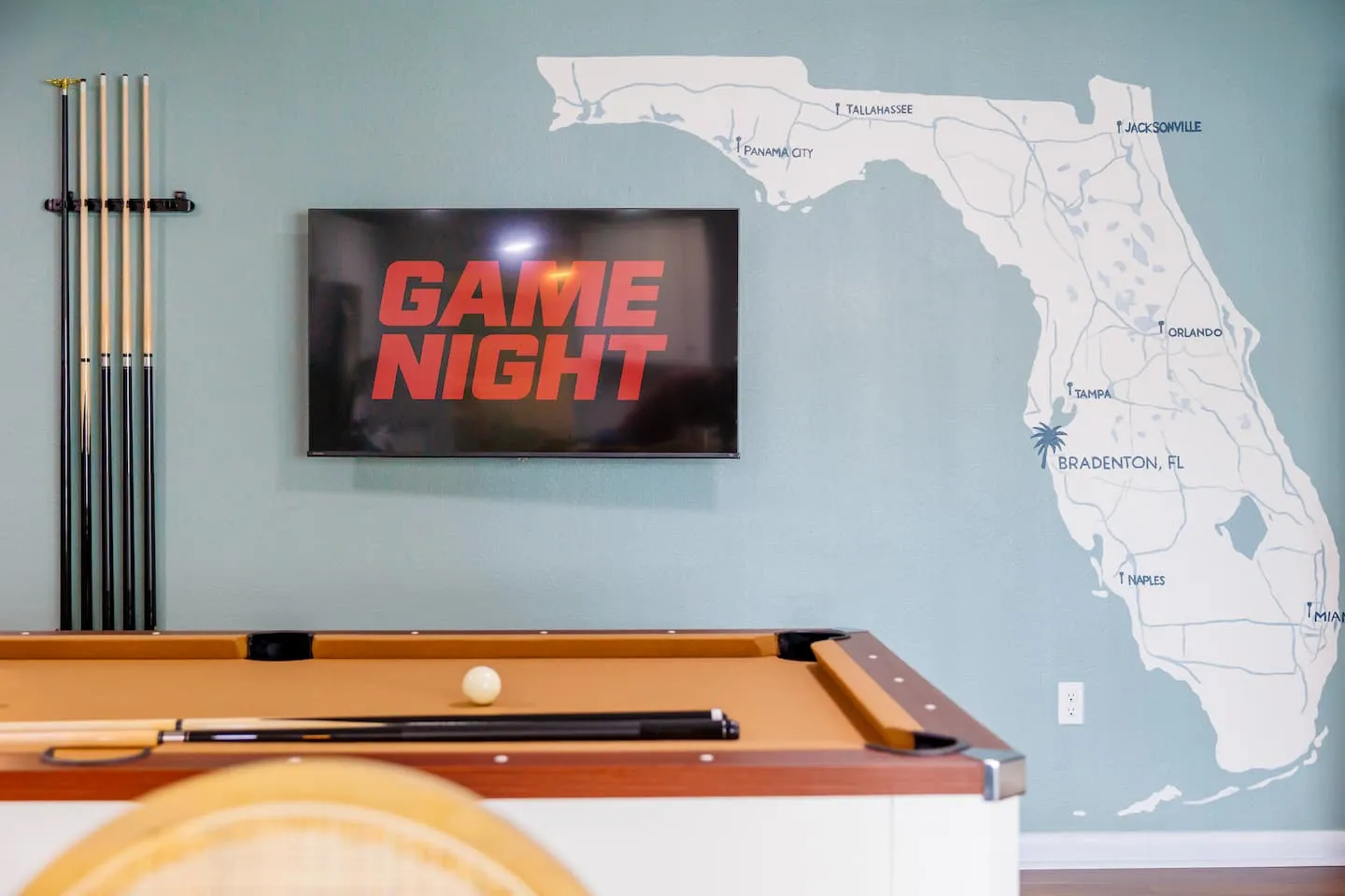 The Breezy Palm: game room with Game Night sign and Florida map mural