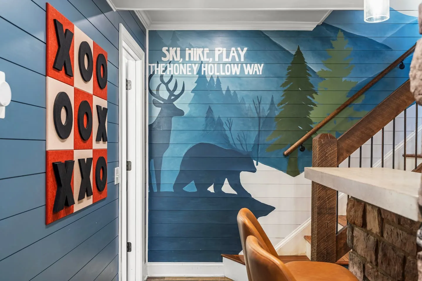 Honey Hollow: game room wall with tic-tac-toe and a mountain mural