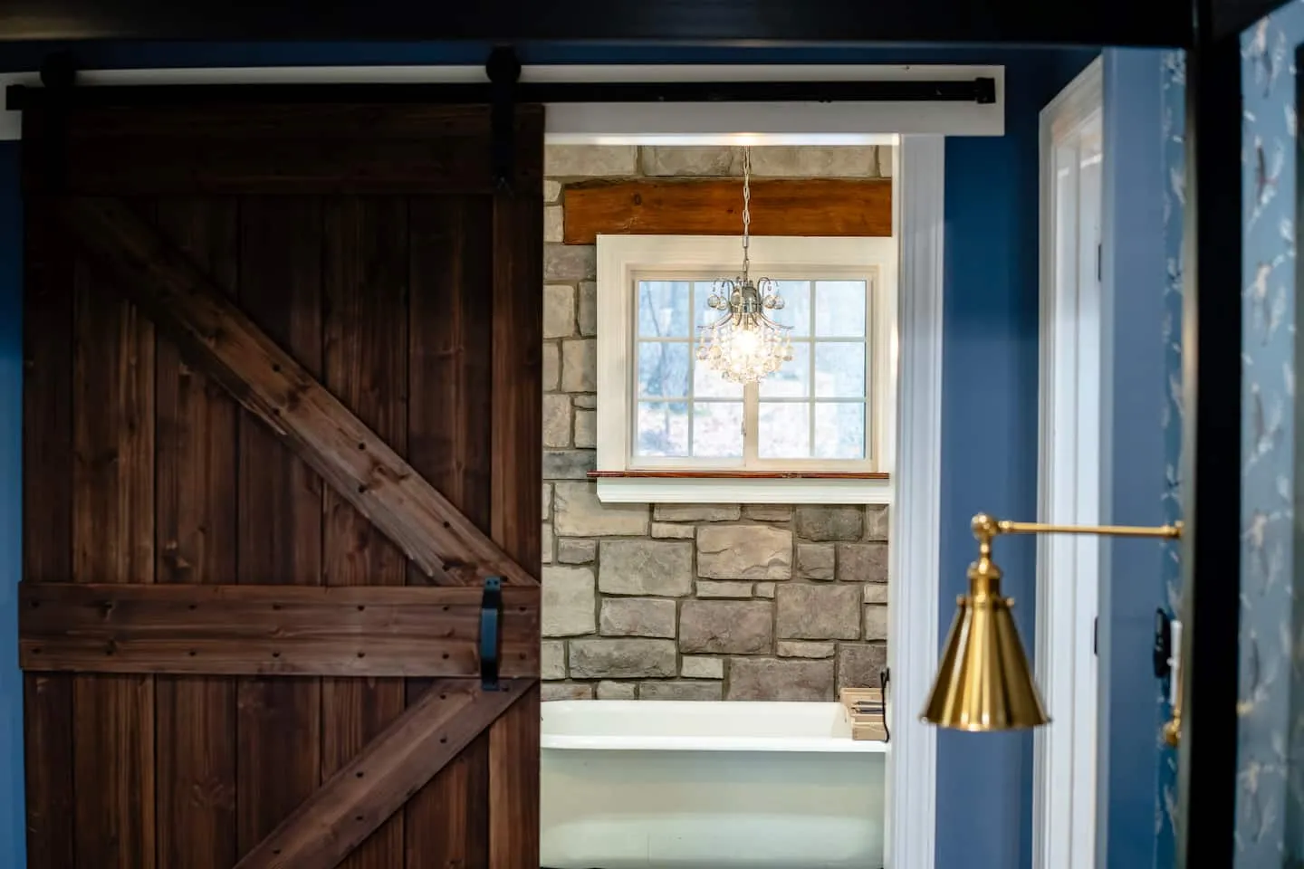 Honey Hollow: sliding barn door to the en-suite bathroom