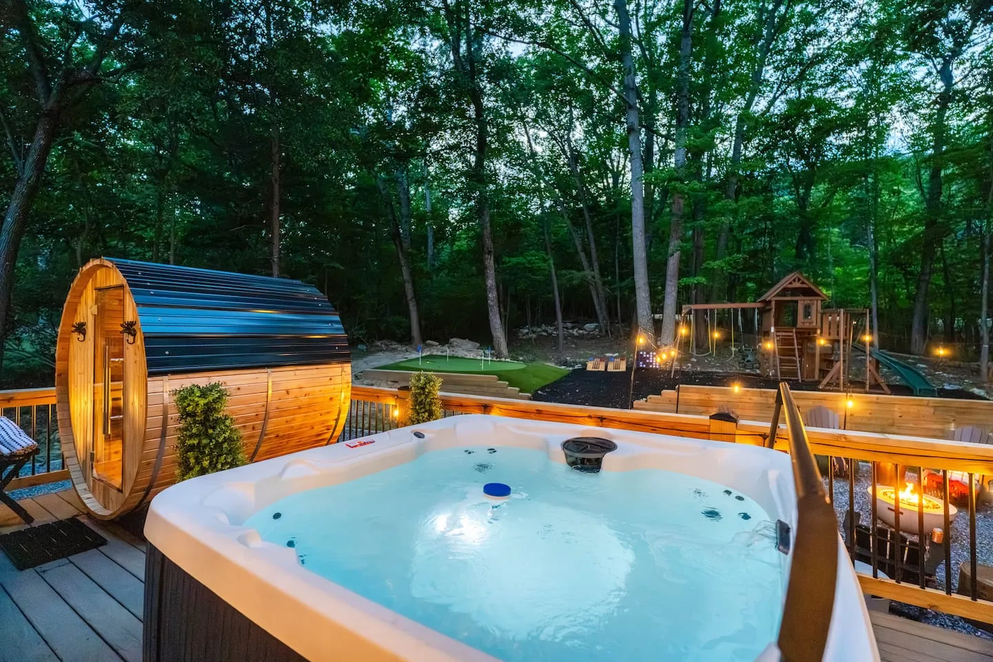 Honey Hollow: hot tub at night under string lights